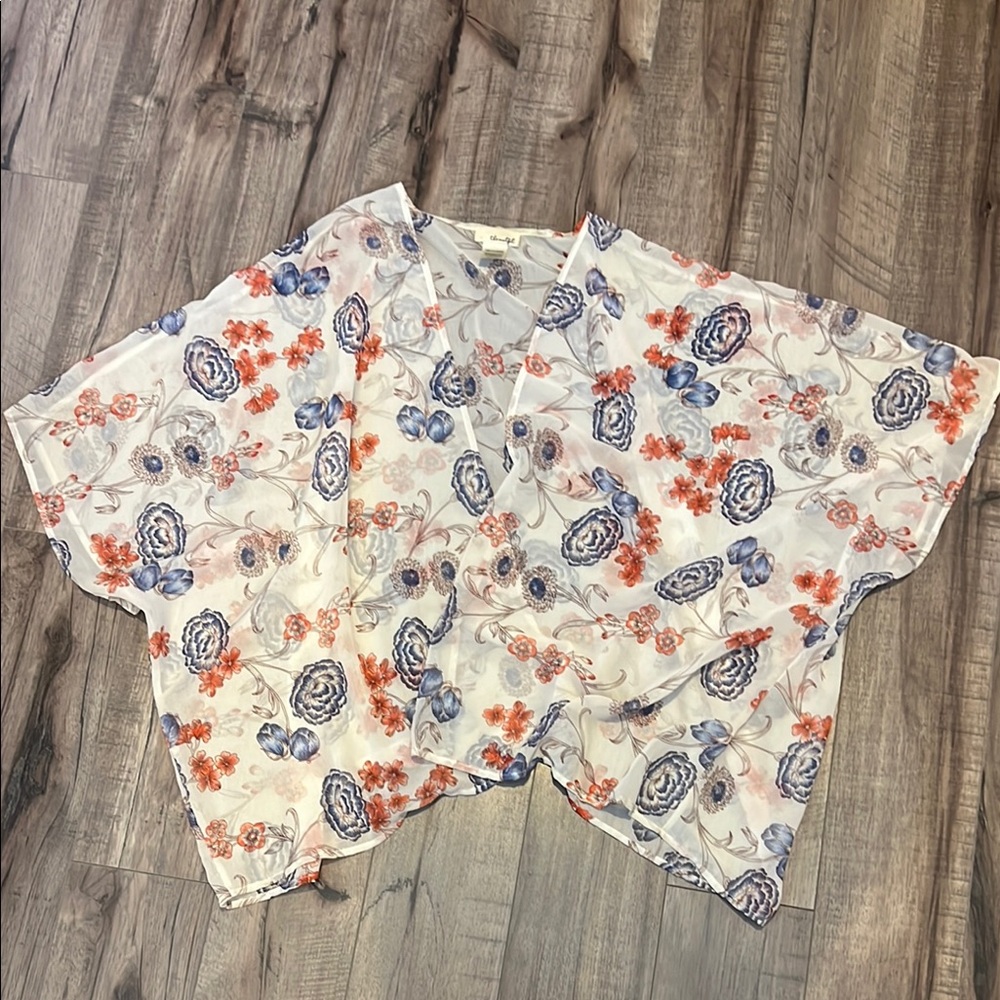 White and Blue Floral Blouse with Playful Patterns